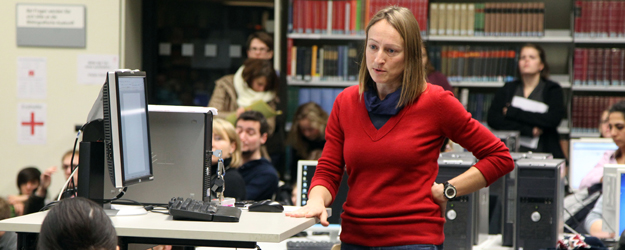 Students scurry from one option to the next throughout the library; in the meeting room there is a course named Students scurry from one option to the next throughout the library; in the meeting room there is a course named