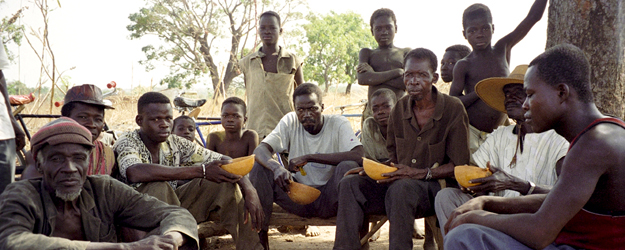 The village chief and the earth priest of Dadoune and several listeners during an interview, province Ioba, Burkina Faso, Nov. 1997 (photo: Carola Lentz)