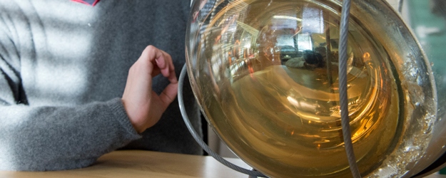 The glass ball encapsulates the 'eye' - the actual sensor that captures the weak blue light generated by neutrino reactions. (photo: Peter Pulkowski)