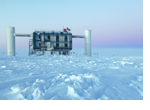View over the ice at the geographic South Pole to the above ground measuring station of the IceCube observatory, where the data from the photo sensors in the ice is extracted and analyzed. (photo/©: Sven Lidstrom, IceCube/NSF) View over the ice at the geographic South Pole to the above ground measuring station of the IceCube observatory, where the data from the photo sensors in the ice is extracted and analyzed. (photo/©: Sven Lidstrom, IceCube/NSF)
